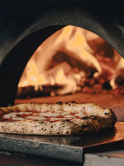 A Margherita basking in the glow of our wood-fired oven. It's a beautiful sight.
