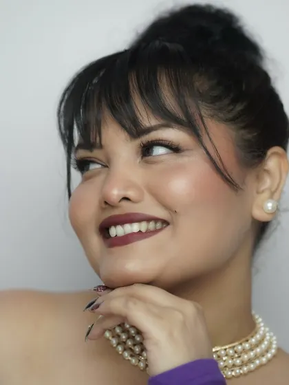 A happy, smiling shot that radiates confidence. The makeup enhances the smile, making it look even brighter.