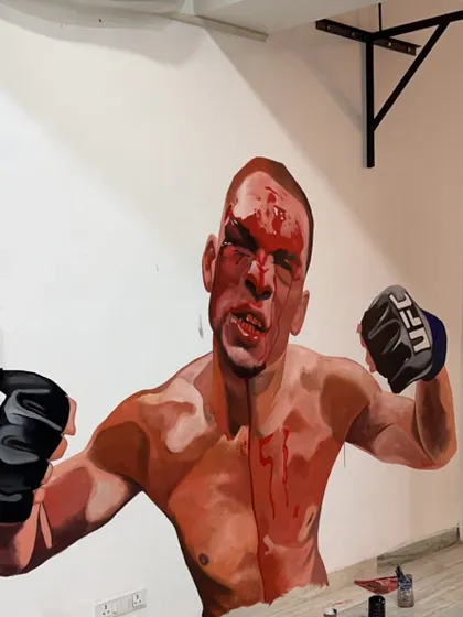A close-up of the finished mural of Nate Diaz. This artwork inspires us daily, reminding us to stay tough, keep fighting, and never back down.