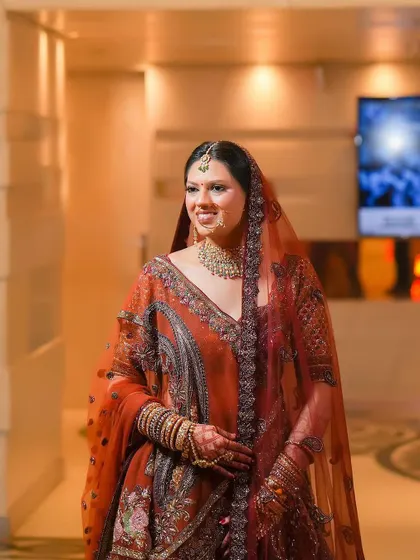 A candid portrait of the bride walking through the hotel corridor. Her natural smile and elegant posture are beautifully captured in this in-between moment.