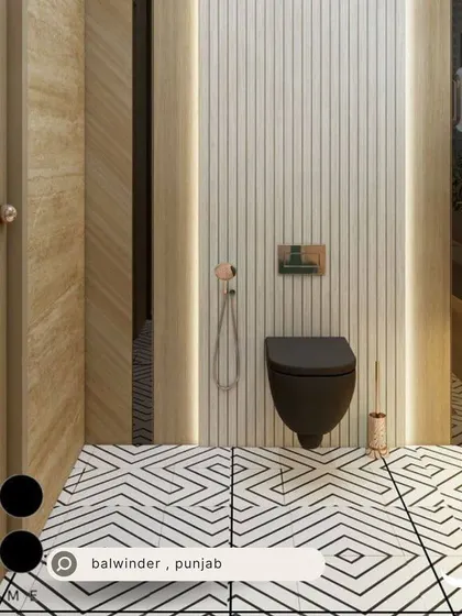 A bathroom for Balwinder in Punjab with bold black and white geometric floor tiles and a wall-hung toilet against a fluted wood panel wall.