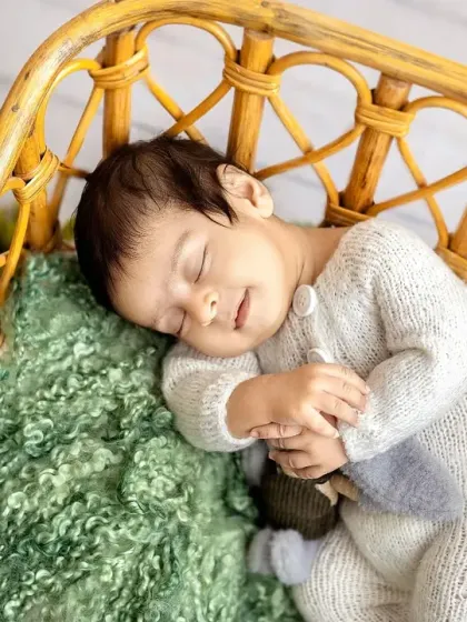 A sweet smile in his sleep. I'm always ready to capture these fleeting expressions that show the happy dreams your little one is having.