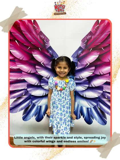 All smiles and angel wings. We believe in creating a joyful and uplifting environment for every child who walks through our doors.
