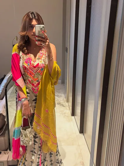 Another festive look, this time a colorful printed sharara. The vibrant hues and modern silhouette make it a fun and stylish choice.