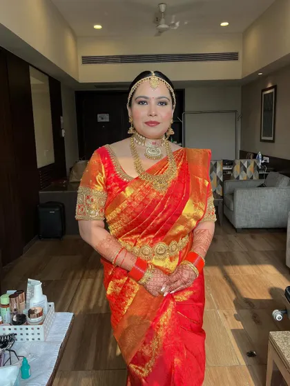 A shot from the getting-ready room, showing the complete look before the ceremony. The makeup is fresh, radiant, and ready for the big day.