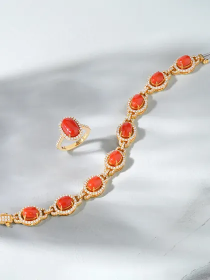The Coral Elegance Set. This handcrafted bracelet and matching ring feature vivid coral stones set in rich gold, surrounded by delicate diamond accents. It is a perfect balance of boldness and grace, designed with you in mind.