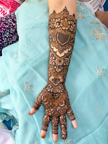 A closer look at a single arm from a full bridal set. You can see the fine details in the heart motif, the delicate flowers, and the intricate line work that I love to create.