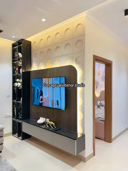 A wider view of the TV unit, showing how it integrates seamlessly into the living space. The design is both a functional media center and a decorative art piece.