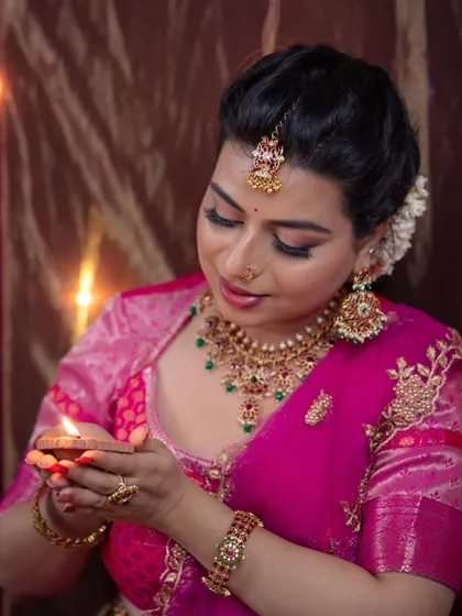 A serene moment captured during the Diwali shoot. This close-up shows the soft blending of the eye makeup and the traditional bindi that completes the look.