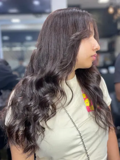 A simple yet beautiful style for long hair, featuring soft layers and gentle curls at the ends for a polished and pretty finish.
