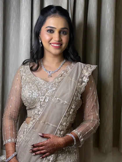 A quick touch-up and a second look for Soniya's engagement, featuring a stunning sequined lehenga.