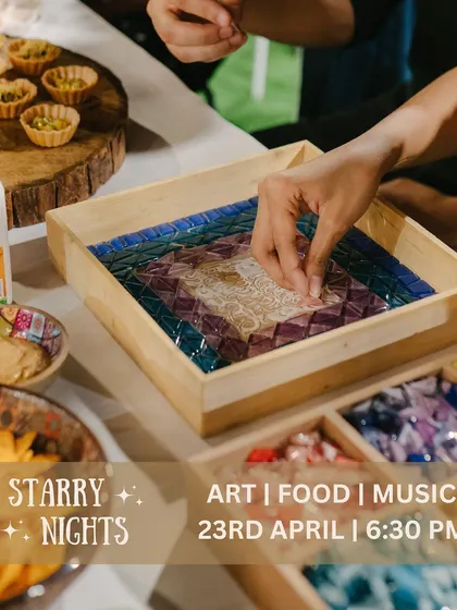 A close-up of a mosaic tray in progress during a 'Starry Nights' event. It's a therapeutic activity that lets you focus and create a beautiful, functional piece of art.