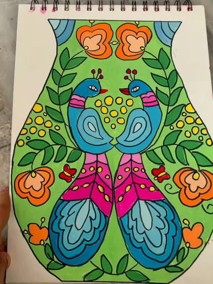 A close-up of the peacock-themed vase design, showcasing the intricate details and vibrant colour choices.