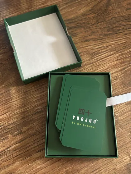A close-up of the Yonjuu game box and cards. I designed the packaging and cards to be tactile and visually appealing, making the learning experience enjoyable from the moment you open the box.