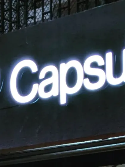 The glowing signage at night, a simple yet powerful branding element.
