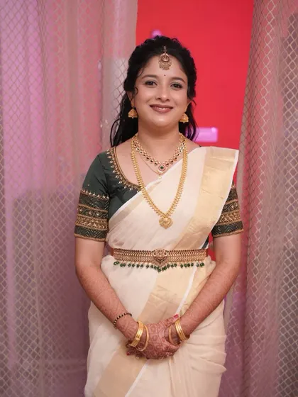 A smiling portrait of the bride-to-be. The makeup enhances her happy glow.