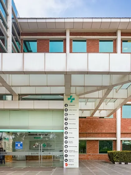The entrance of Max Super Speciality Hospital in Bhatinda is designed to be welcoming and easily navigable. A large canopy provides shelter, while clear signage directs patients and visitors to various departments.