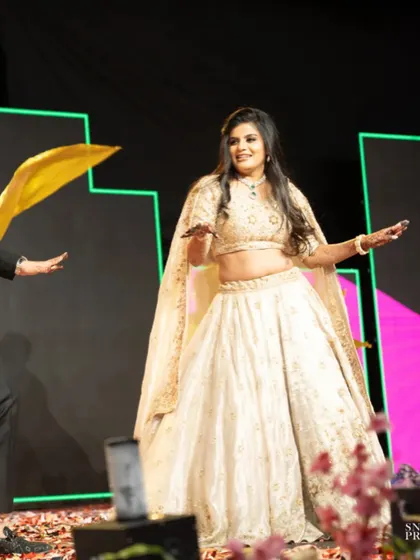Another happy moment from the sangeet night. Her open hairstyle with soft waves allowed for easy movement while dancing.