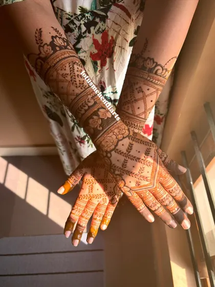A stunning engagement mehendi for Dr. Divya, with beautiful floral patterns and geometric work.