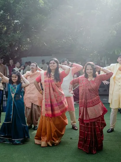 Guests from different backgrounds come together to perform a dance at a multicultural Sangeet.