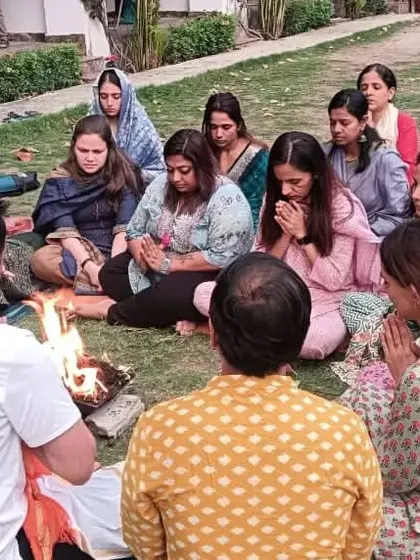 Students participate in an outdoor Havan, connecting with the element of fire and the purifying power of ancient mantras.