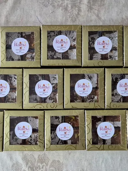 A bulk order of Moong Daal Barfi packed in beautiful golden window boxes, each with my brand sticker. Perfect for corporate or festive gifting.