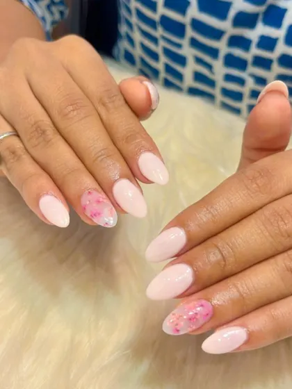 Another look at this pretty pink floral design. The watercolor-style flowers on the accent nails add a soft, artistic touch to the manicure.