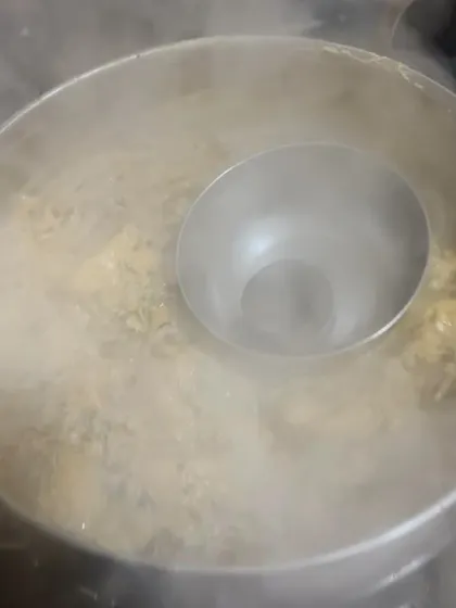 The 'dum' cooking process for my biryani, where the pot is sealed to trap the steam, allowing the flavors to meld together perfectly.