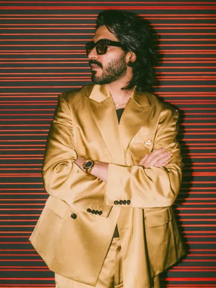 A side profile of Harshvarrdhan Kapoor's look, highlighting the texture and shape of his mid-length style.