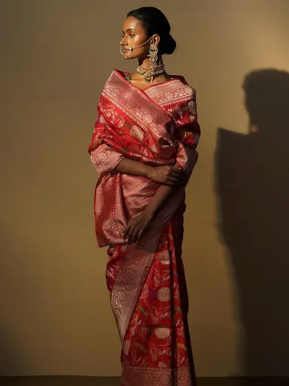 Another angle of the red Banarasi, showcasing the complete look with the traditional jewellery and styling.