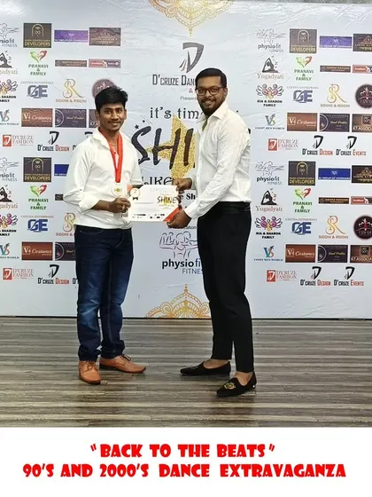 Another proud participant receiving his award on stage.