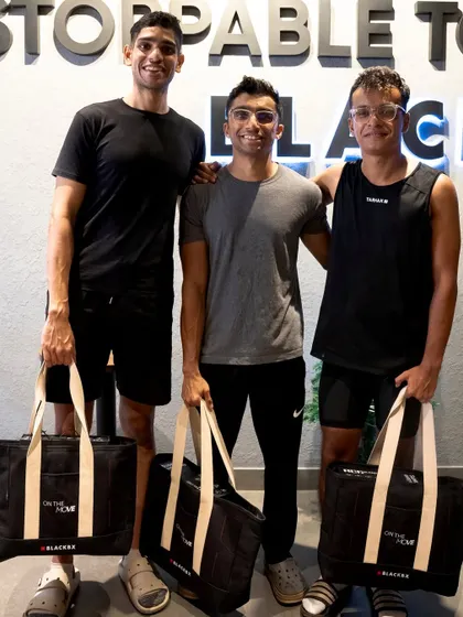 Here are the second-place winners, Sole Survivor, holding their prize bags after a hard-fought 74-minute race.