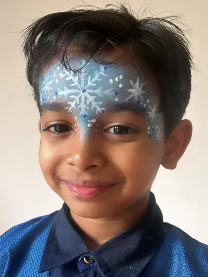 A full forehead snowflake design, creating a magical winter crown effect. Perfect for a Frozen-themed party or a Christmas event.