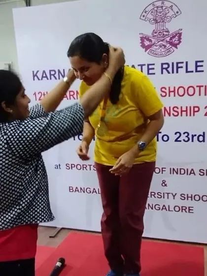 A moment of victory as a student receives her medal at the Karnataka State Rifle Association shooting championship. Every medal represents countless hours of dedication.