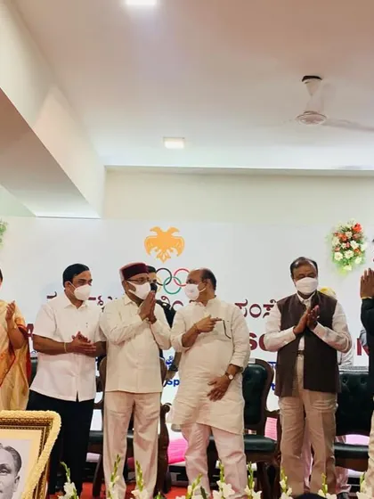A moment of respect on stage during the felicitation ceremony. These events are important for celebrating our sporting culture and inspiring the next generation of athletes.