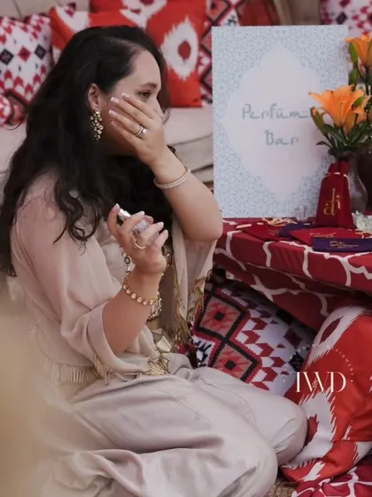 Our co-founder testing a freshly blended scent at our interactive Perfume Bar. This unique station allowed guests to mix their own fragrances, creating a personalized and memorable wedding favor.