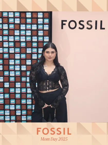 A stylish guest poses at the Fossil brand activation. The custom-branded photo overlay reinforces the brand's identity in every picture shared by attendees.