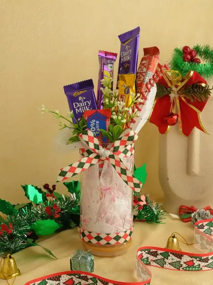 A festive chocolate bouquet perfect for Christmas or as a Secret Santa gift. It's a fun and delicious alternative to a traditional flower bouquet.