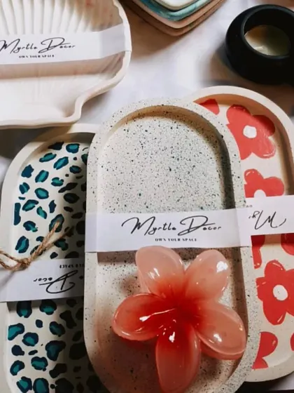 A collection of our hand-painted and patterned trays ready for a market. We love creating these unique designs for you.
