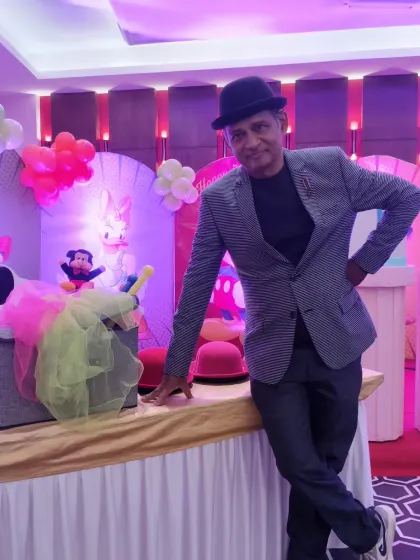 Dressed for a classic magic show at a Mickey Mouse themed party. I often use simple props and costumes, like this bowler hat, to add to the performance.