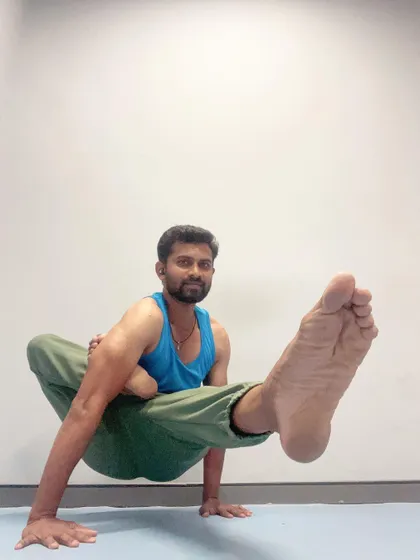 Holding Elephant's Trunk Pose requires you to find a point of focus, or drishti, to maintain balance and mental stillness.