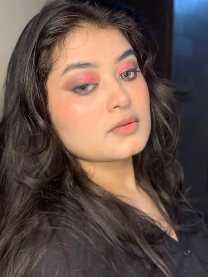 A closer look at the pink and black smokey eye.