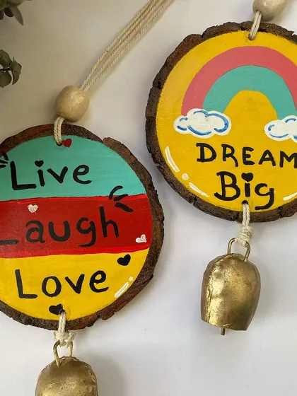 The "Live Laugh Love" and "Dream Big" hangings are a colorful and uplifting addition to any wall.