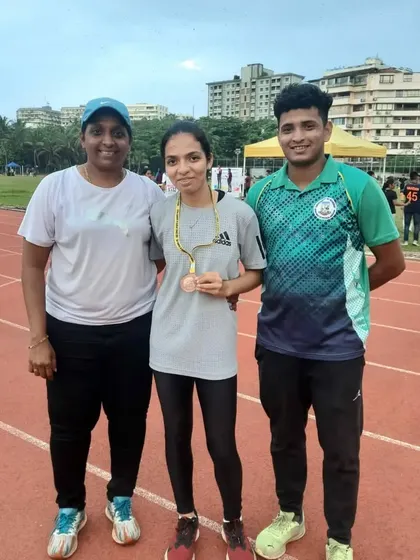 With my athlete Daphne Johnson after she won a bronze medal in the 200m run at the zonal meet.