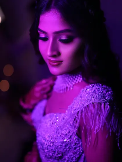 Using creative purple lighting to create a moody and glamorous portrait of the bride during her reception. I experiment with different lighting techniques to match the vibe of the event and produce unique, eye-catching images.