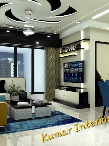 This living room features a unique false ceiling design with a spiral motif, adding a dynamic visual element. The modular TV unit and coordinated furniture create a harmonious and stylish space perfect for entertaining.