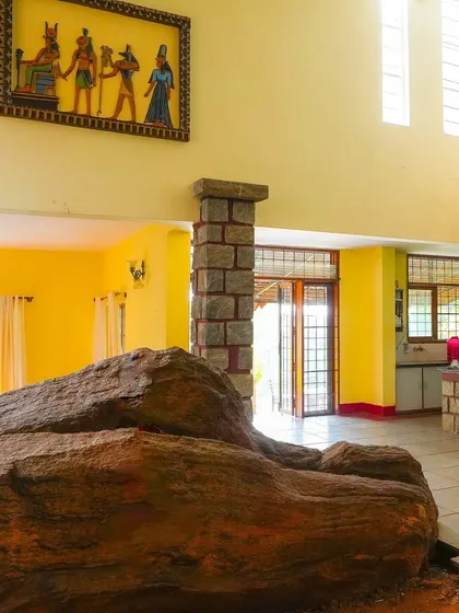 A different perspective of the villa's interior, showcasing the high ceilings and unique decor.