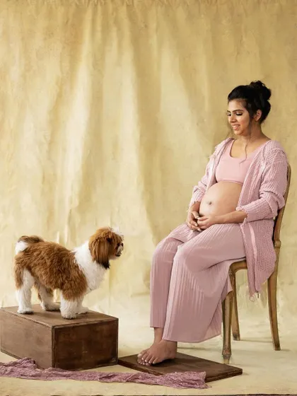 A quiet moment of connection. Including your beloved pet in your maternity shoot adds another layer of love and warmth to these precious memories.