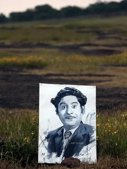 The finished Kishore Kumar portrait, displayed in a field. It felt like a fitting way to honor an artist who brought so much life to his work.