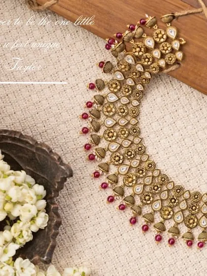 A flat-lay composition for a Manjali Jewellers necklace. I used a bed of jasmine flowers and a textured cloth to create a soft, traditional, and fragrant setting that enhances the beauty of the kundan-style jewelry.